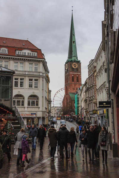 Tourists in the gothic style city center with ancient buildings and cathedral Lübeck Schleswig Holstein Germany Europe