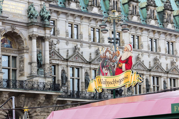 Christmas market and decorations surrounded by neoclassic architecture Rathaus square Altstadt quarter Hamburg Germany Europe