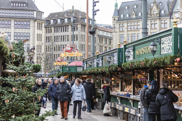 Christmas market and decorations surrounded by neoclassic architecture Rathaus square Altstadt quarter Hamburg Germany Europe