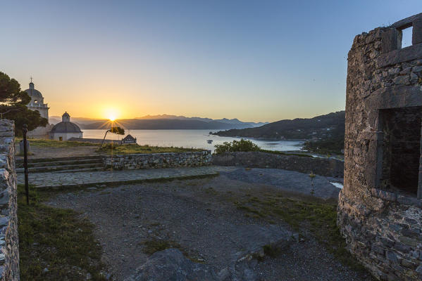 Sunrise on the old ruins and church perched on the promontory Portovenere province of La Spezia Liguria Italy Europe