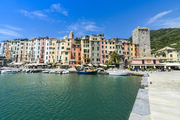 The turquoise sea frames the typical colored houses of Portovenere La Spezia province Liguria Italy Europe