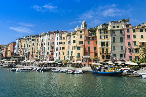 The turquoise sea frames the typical colored houses of Portovenere La Spezia province Liguria Italy Europe