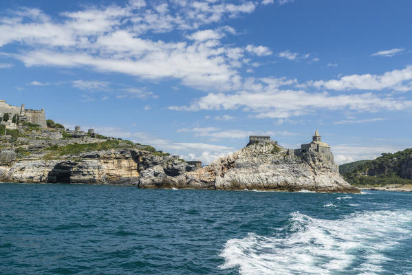 Blue sea frames the ancient church perched on the promontory Portovenere province of La Spezia Liguria Italy Europe
