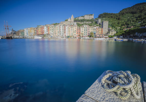 View of blue sea surrounding the colorful village at dusk Portovenere province of La Spezia Liguria Italy Europe