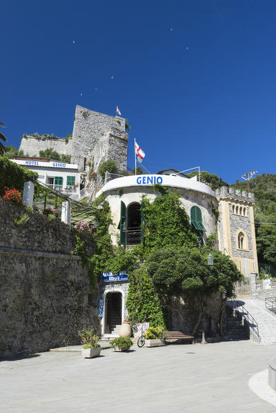 The Hotel Genio with medieval tower and green hills in the background Portovenere province of La Spezia Liguria Italy Europe