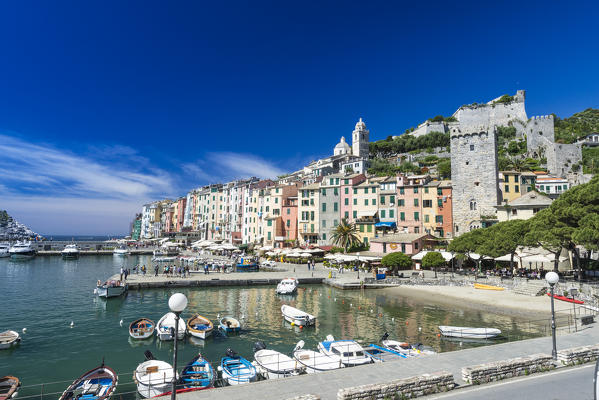 Boats in the harbour frame the picturesque colored houses of Portovenere Province of La Spezia Liguria Italy Europe