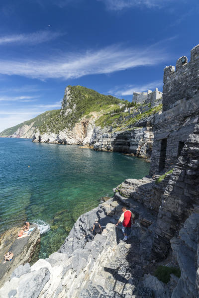 Turquoise sea and cliffs frame the old castle perched on promonotry Portovenere province of La Spezia Liguria Italy Europe