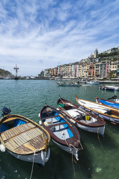Boats in the blue sea frame the typical colored houses of Portovenere La Spezia province Liguria Italy Europe