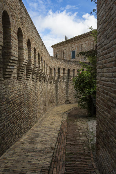 A typical alley and medieval walls of the old town of Corinaldo Province of Ancona Marche Italy Europe