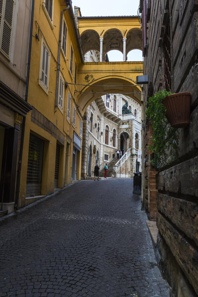 A typical alley and architecture of the old town of Fermo Marche Italy Europe