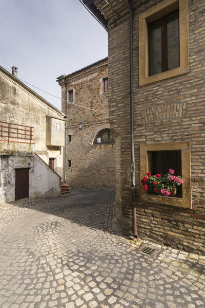 A typical alley of the medieval village perched on the hill Offagna Province of Ancona Marche italy Europe