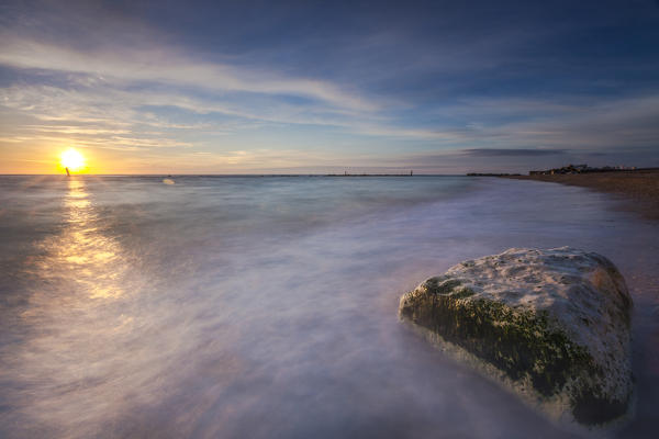 The light of dawn is reflected in the clear water of sea Porto Recanati Province of Macerata Conero Riviera Marche Italy Europe
