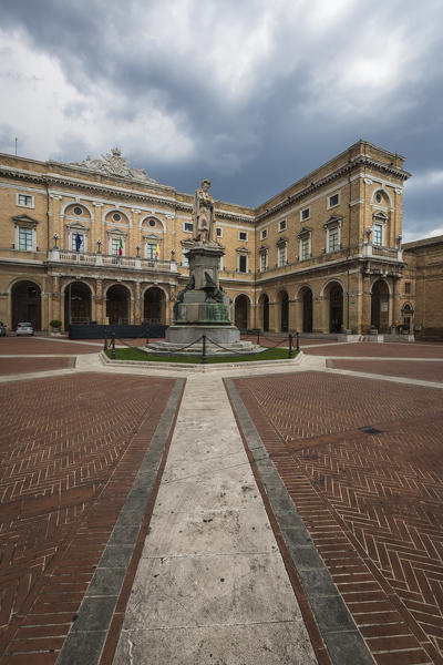 A memorial statue of the poet Giacomo Leopardi in the middle of the old square Recanati Province of Macerata Marche Italy Europe