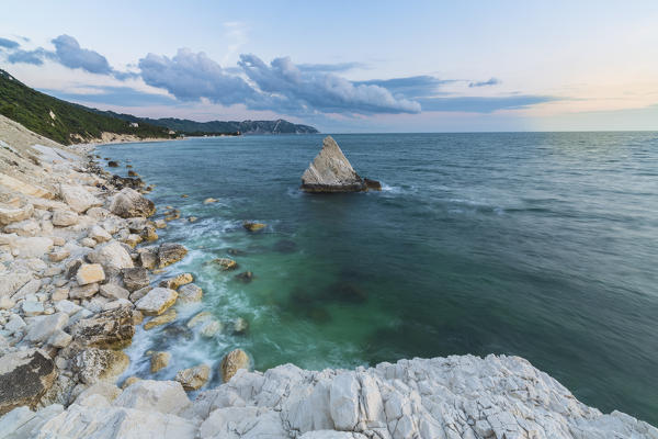 White cliffs frame the turquoise sea at sunrise La Vela Beach Portonovo province of Ancona Conero Riviera Marche Italy Europe