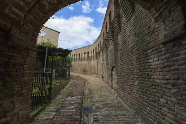 A typical alley and medieval walls of the old town of Corinaldo Province of Ancona Marche Italy Europe