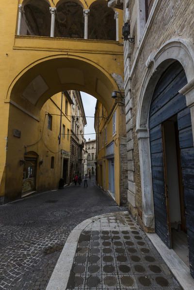 A typical alley and architecture of the old town of Fermo Marche Italy Europe