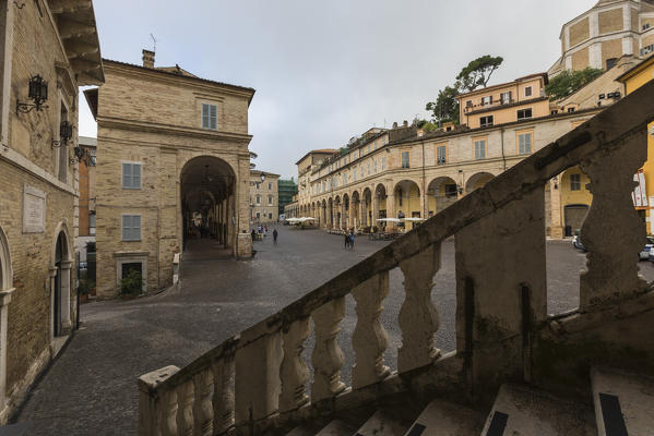 A typical flight of steps among the historical buildings and arcades of Piazza del Popolo Fermo Marche Italy Europe