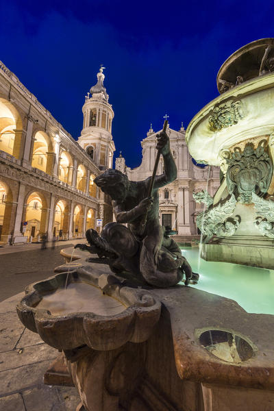 Night view of the Basilica of the Holy House and fountain decorated with statues Loreto Province of Ancona Marche Italy Europe