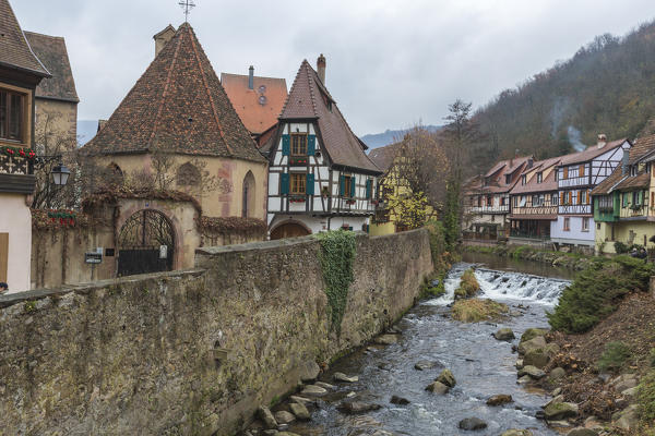 Typical architecture of the old medieval town and bridge on river Weiss Kaysersberg Haut-Rhin department Alsace France Europe