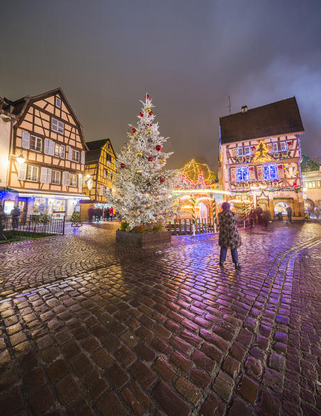 Typical houses enriched by Christmas ornaments and lights at dusk Colmar Haut-Rhin department Alsace France Europe