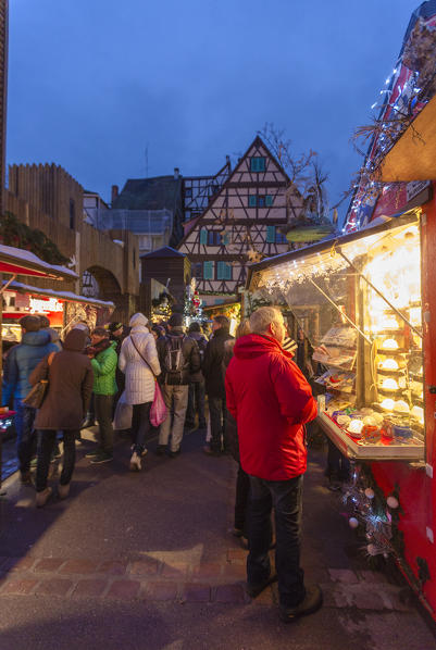 Tourists shopping at the Christmas Markets in the old medieval town of Colmar Haut-Rhin department Alsace France Europe