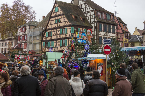 Tourists and Christmas Markets in the old medieval town of Colmar Haut-Rhin department Alsace France Europe