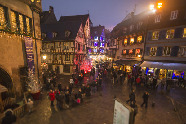 Tourists and Christmas Markets in the old medieval town of Colmar Haut-Rhin department Alsace France Europe