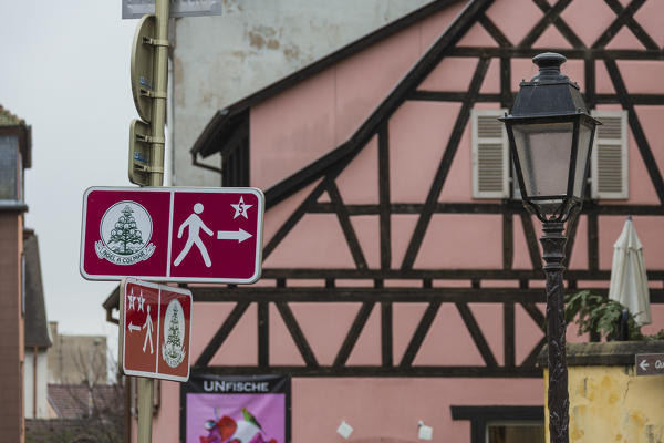 Road signs and street lamp frame the typical medieval old town Petite Venise Colmar Haut-Rhin department Alsace France Europe