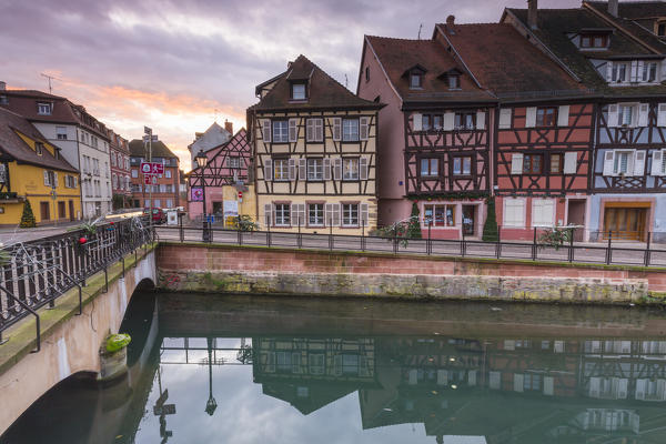 Colored houses reflected in river Lauch at sunset Petite Venise Colmar Haut-Rhin department Alsace France Europe