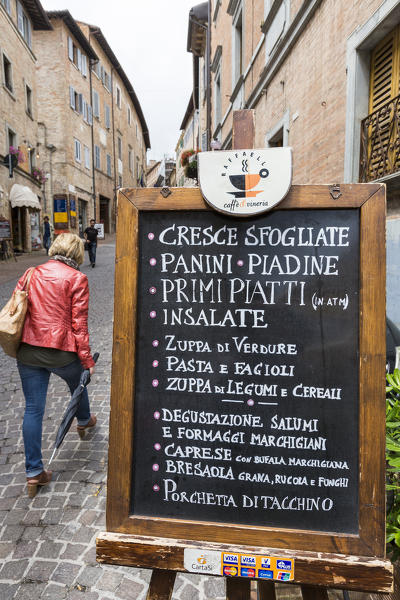 Typical food shop in the alleys of the ancient medieval hill town of Urbino Province of Pesaro Marche Italy Europe