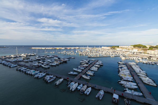 Blue sea frames the boats moored in the harbor Otranto province of Lecce Apulia Italy Europe