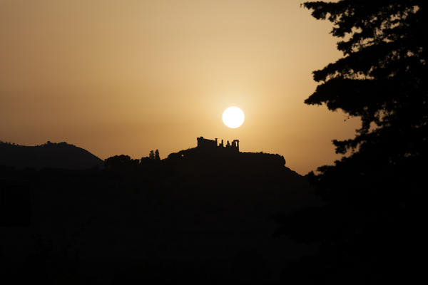 Sunset frames the Temple of Juno a Greek temple of the ancient city of Akragas Valle dei Templi Agrigento Sicily Italy Europe