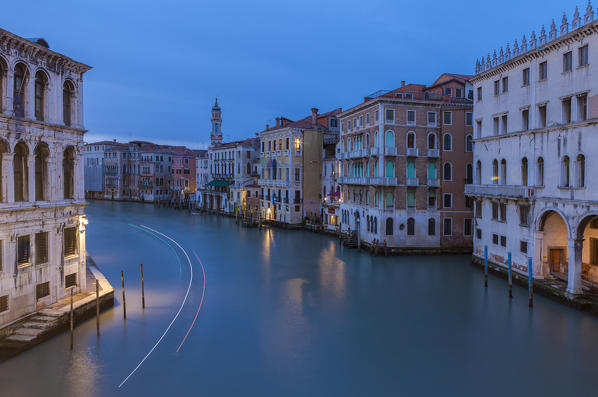 Dusk lights on the Canal Grande surrounded by historical buildings and houses Venice Veneto Italy Europe