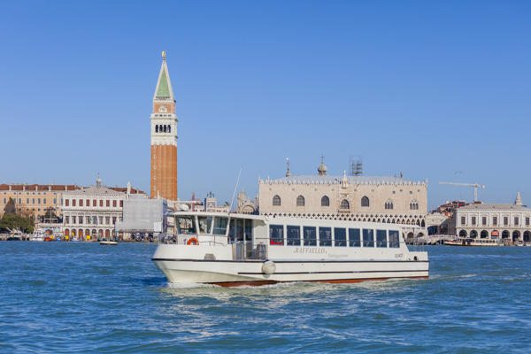 A tourist boat also known as Vaporetto frames the historical Piazza San Marco Venice Veneto Italy Europe