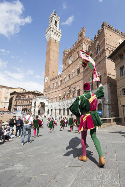 Typical exhibition of traditional clothes and flags of the different contradas Piazza del Campo Siena Tuscany Italy Europe