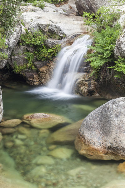 View of the Purcaraccia waterfalls and natural pools in summer Punta di Malanda Bavella Mountains Quenza Corsica France Europe