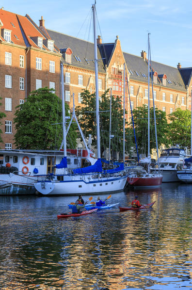 People in kayak in Christianshavn Canal, Copenhagen, Denmark