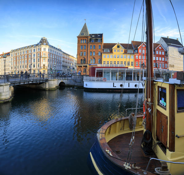 Panoramic of Christianshavn Canal and colorful houses on the background, Copenhagen, Denmark