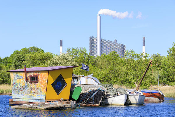 Boats and floating house seen from boat trip along the canals of Copenhagen, Denmark