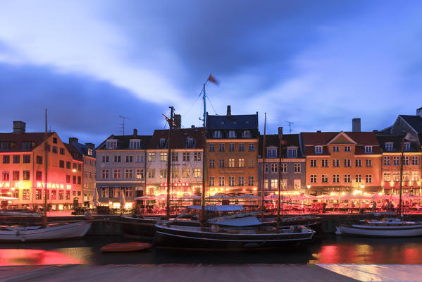Night view of the illuminated harbour and canal of the entertainment district of Nyhavn, Copenhagen, Denmark, Europe