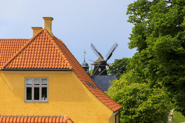 Windmills and colorful house at The Citadel (Kastellet), Copenhagen, Denmark