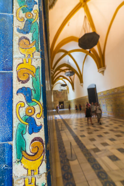 Close-up and details of figures and symbols on old painted wall in the indoor aisle and corridor of Real Alcazar, Seville, Andalusia, Spain