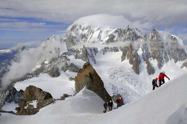 Mountaineers climbing Mont Blanc (Monte Bianco) massif (Mont Blanc on background), from Dente del Gigante,route to Aiguille de Rochefort, Aosta Valley, Italy, Europe