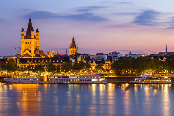 Gross St. Martin church and River Rhine at dusk in Cologne city. 
Cologne city (Koln), North Rhine Westphalia, Germany, Europe. 