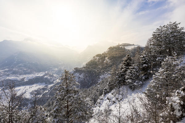 Winter sunset on Saint-Nicolas Curch and central valley, Saint-Nicolas, Aosta Valley, Italy
