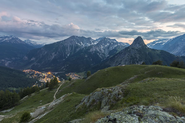 Upper view of Courmayeur and Mont Chétif at dusk from Rifugio Bertone, Courmayeur, Aosta Valley, Italy