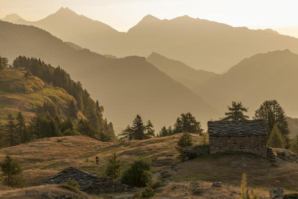 Old alp in the high valley of Champorcher at sunrise, Aosta Valley, Italy, Europe