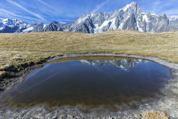 Grandes Jorasses reflected in little lake on Mont de la Saxe in autumn, Courmayeur, Aosta Valley, Italy, Europe