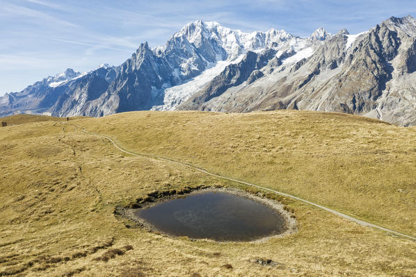 Aerial view of little lake on Mont de la Saxe and Mont Blanc in autumn, Courmayeur, Aosta Valley, Italy, Europe