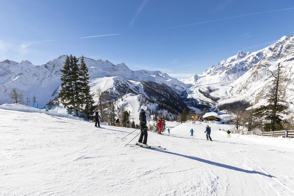 Skiers on Courmayeur ski resort, Valdigne, Aosta Valley, Italy